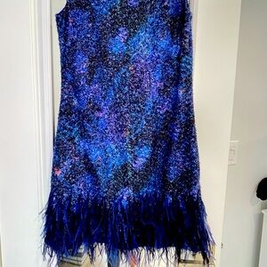 gorgeous cocktail dress with feathers at the bottom